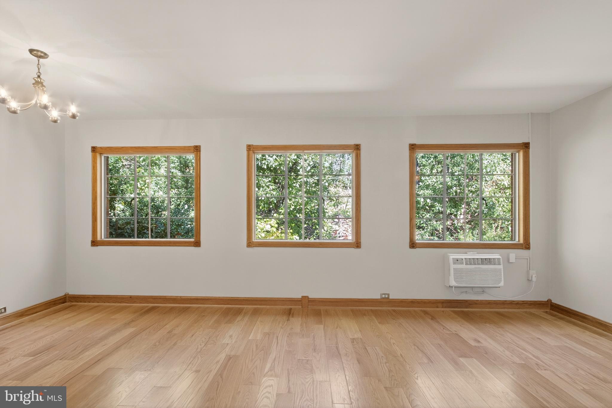 1649 Preston Road Alexandria, VA 22302 - Photo 8 of 31 a view of an empty room with a window and wooden floor