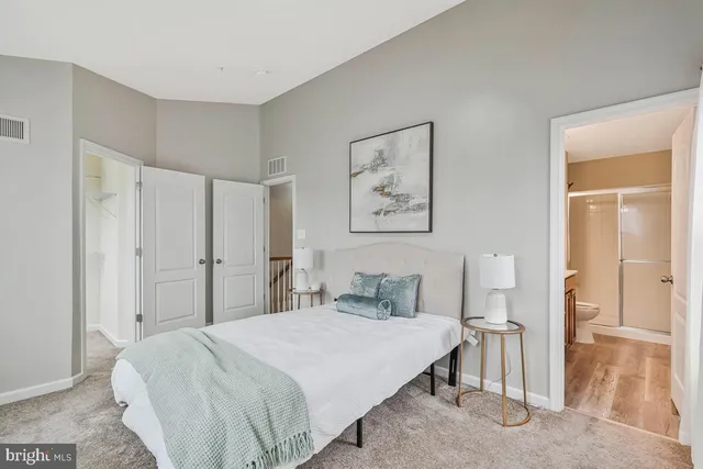 a bathroom with a sink toilet a mirror and shower