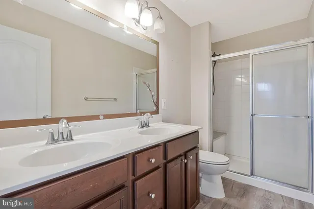 a bathroom with a glass shower door