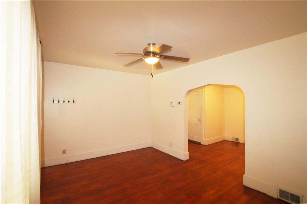 1140 13th Street McKees Rocks, PA 15136 - Photo 10 of 29 a view of a room with a chandelier fan and wooden floor