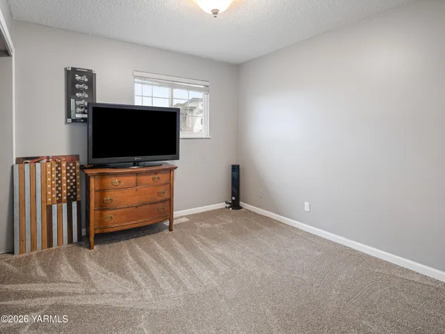 a room with furniture and flat screen tv