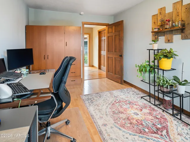 a workspace with furniture and rug