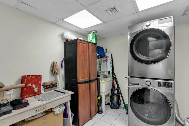 a view of a storage and utility room with washer and dryer