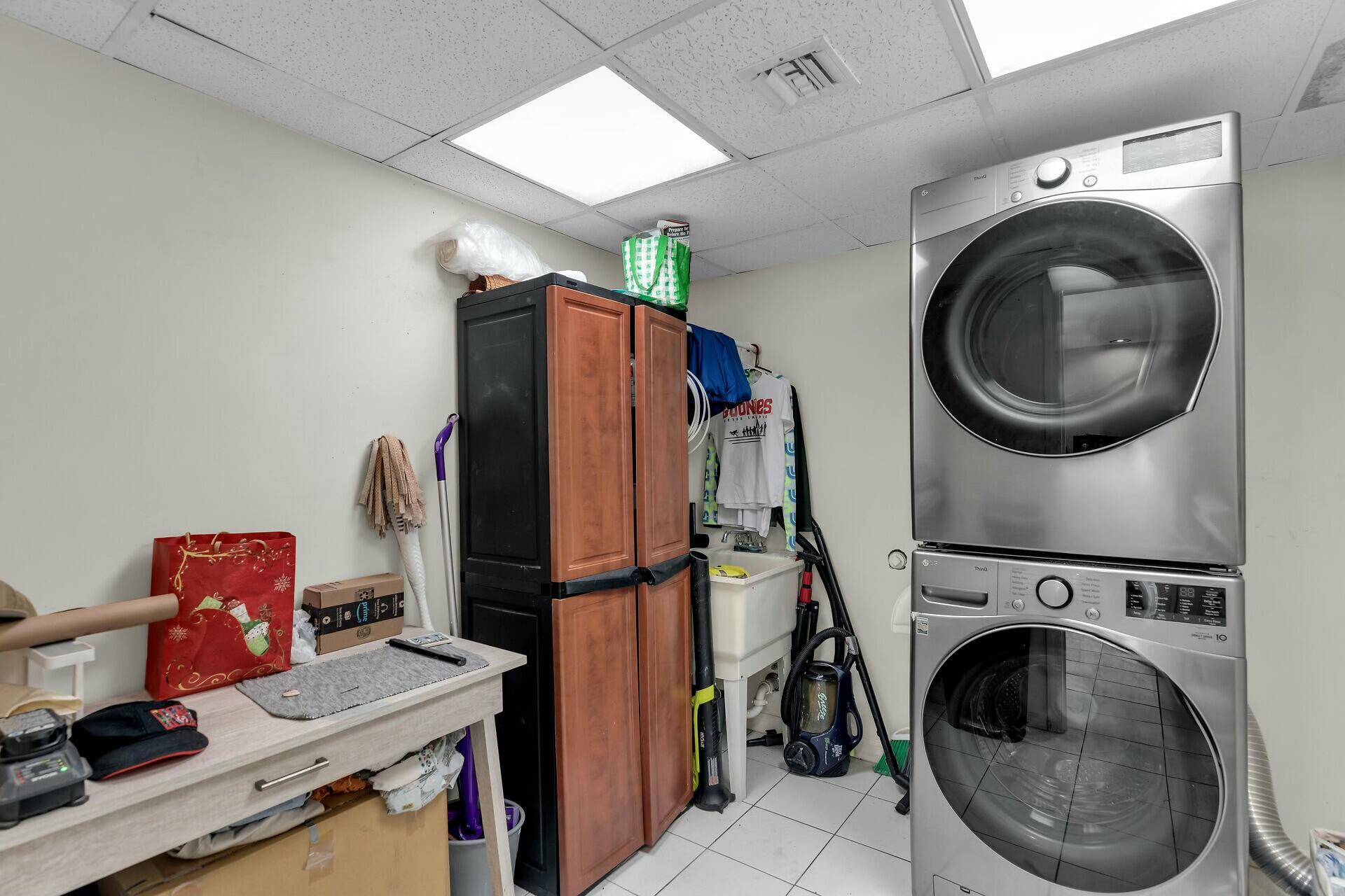 1106 17th Street Key West, FL 33040 - Photo 11 of 33 a view of a storage and utility room with washer and dryer
