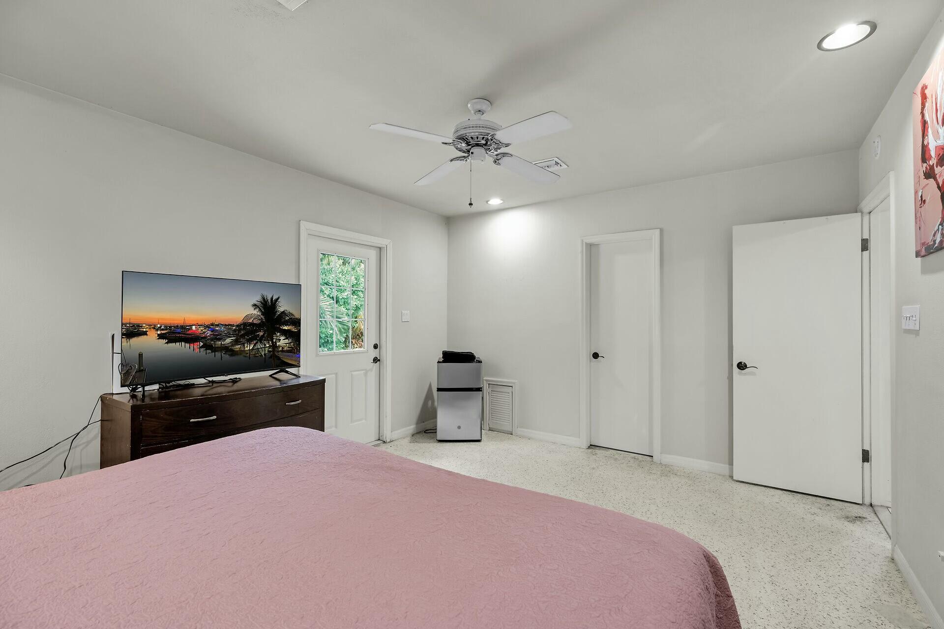 1106 17th Street Key West, FL 33040 - Photo 14 of 33 a bedroom with a bed and a flat screen tv