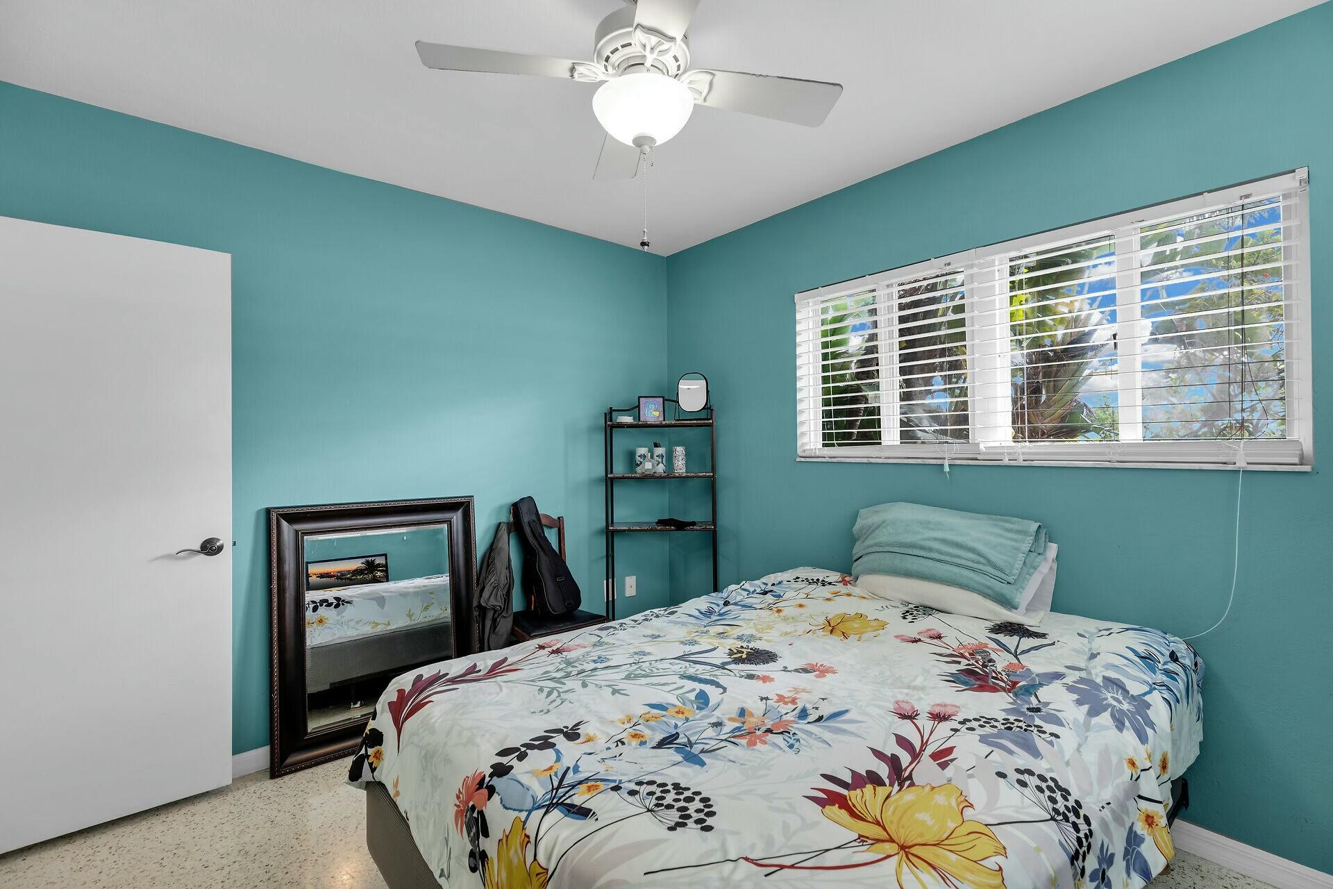 1106 17th Street Key West, FL 33040 - Photo 18 of 33 a bedroom with a bed and a window