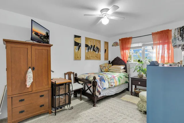 a bedroom with a bed and a couch