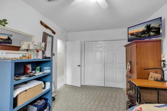 a bathroom with a sink vanity mirror and toilet