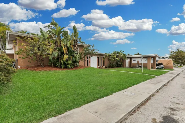 a view of a garden with a house