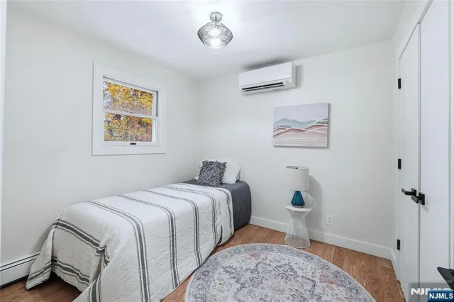 a bedroom with a bed and a lamp