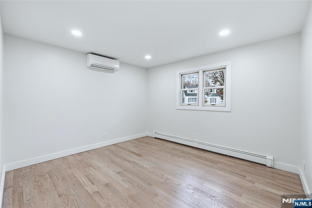 20 Dojean Court Bergenfield, NJ 07621 - Photo 14 of 30 a view of a room with wooden floor and window