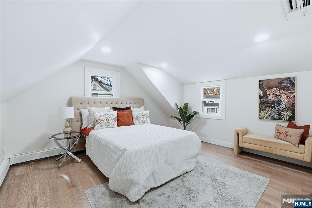 20 Dojean Court Bergenfield, NJ 07621 - Photo 20 of 30 a bedroom with a bed and a couch