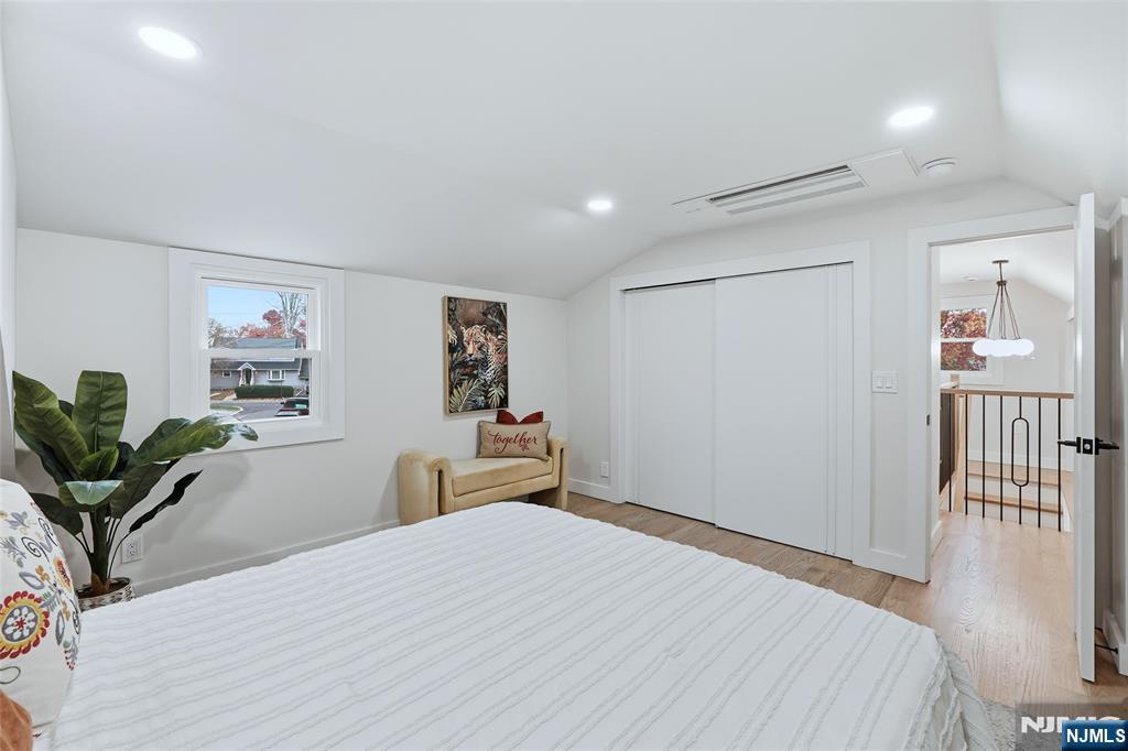 20 Dojean Court Bergenfield, NJ 07621 - Photo 21 of 30 a bedroom with a bed and wooden floor