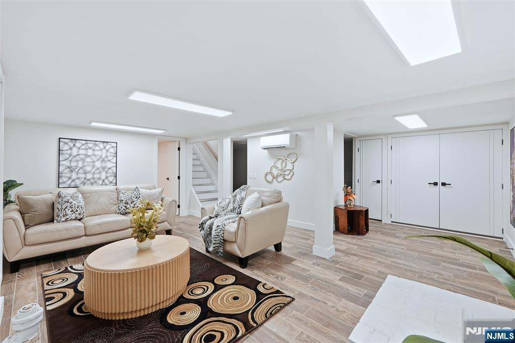 20 Dojean Court Bergenfield, NJ 07621 - Photo 23 of 30 a living room with furniture and a wooden floor
