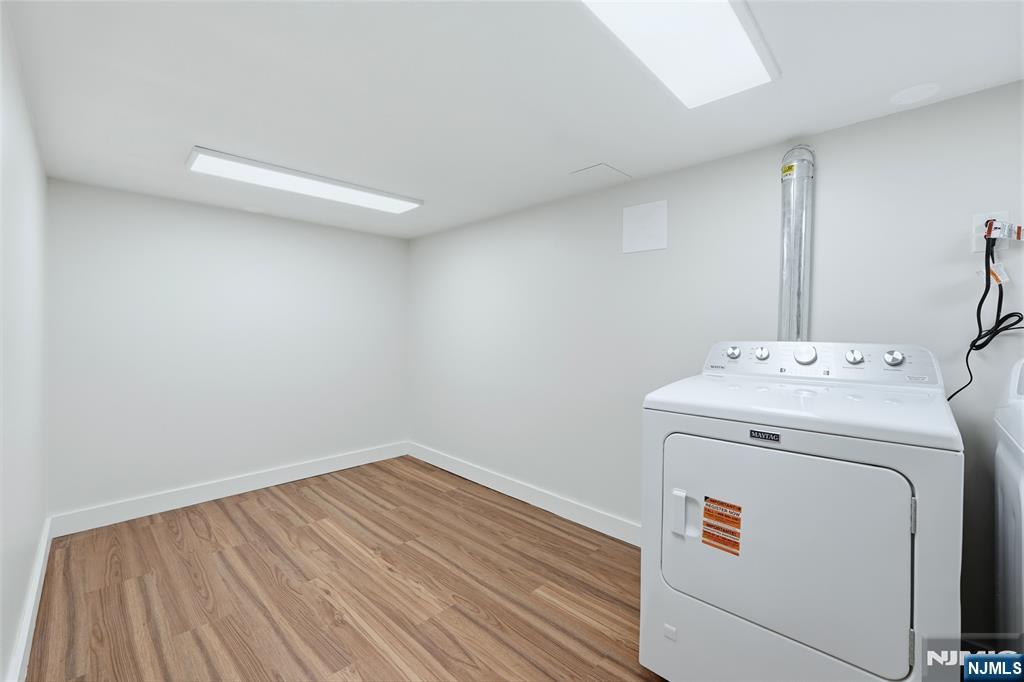 20 Dojean Court Bergenfield, NJ 07621 - Photo 24 of 30 a utility room with dryer and washer