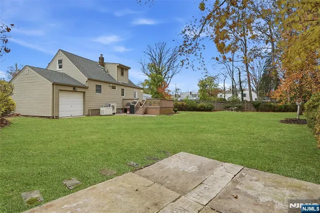 a view of a front of house with a big yard