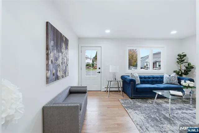 a living room with furniture and a rug