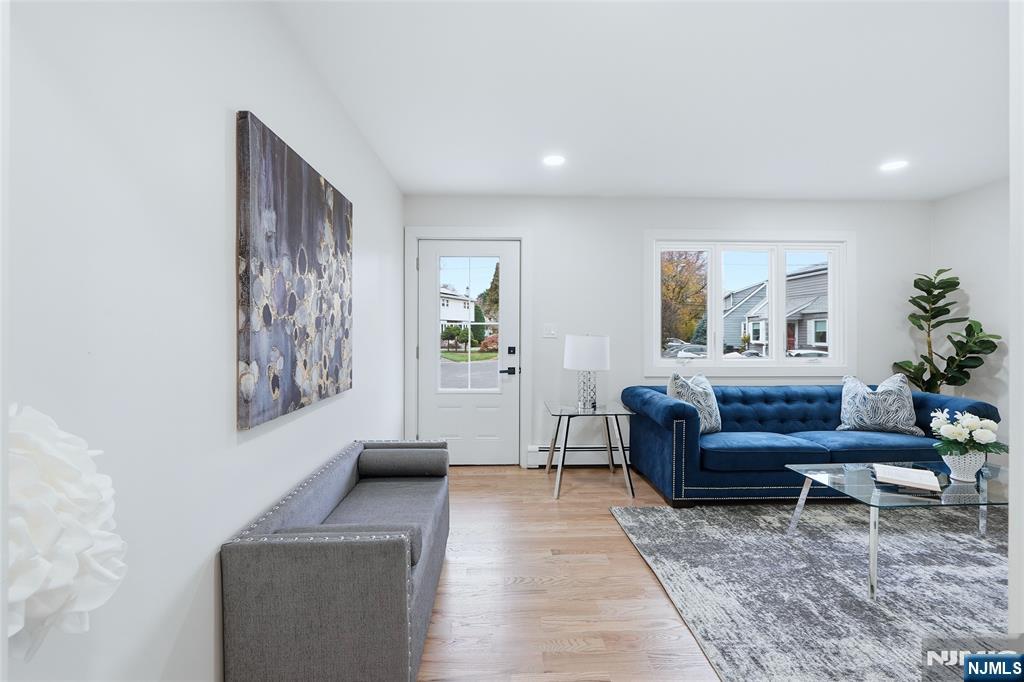20 Dojean Court Bergenfield, NJ 07621 - Photo 6 of 30 a living room with furniture and a rug
