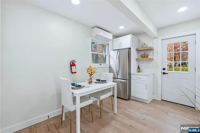 a kitchen with stainless steel appliances a refrigerator and a stove