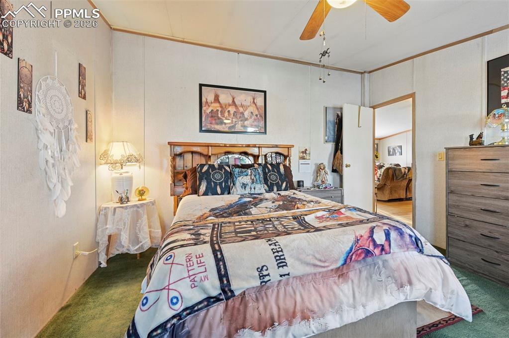 35875 Shear Road Yoder, CO 80864 - Photo 23 of 45 a bedroom with a bed and a table