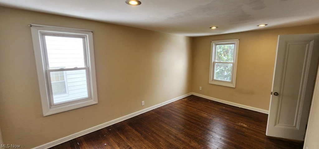 3599 Grosvenor Road Cleveland, OH 44118 - Photo 14 of 25 Spare room featuring dark wood-style flooring and recessed lighting