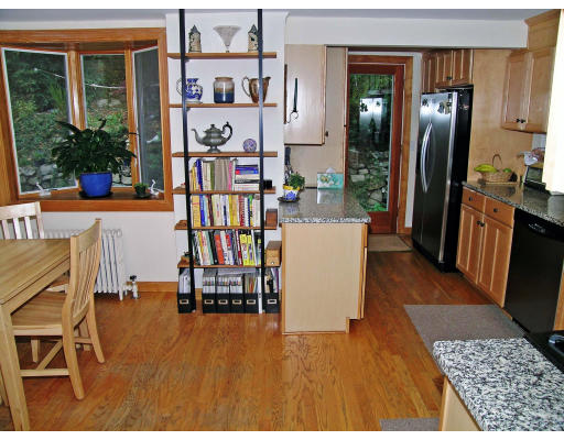 217 Varick Road Newton, MA 02468 - Photo 8 of 23 a living room with dining room and wooden floor