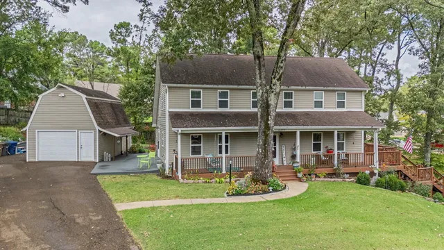 an aerial view of residential house with outdoor space and lake