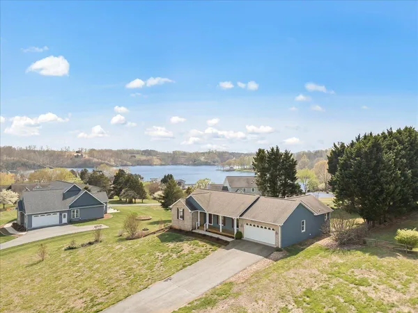 a view of a terrace with lawn chairs