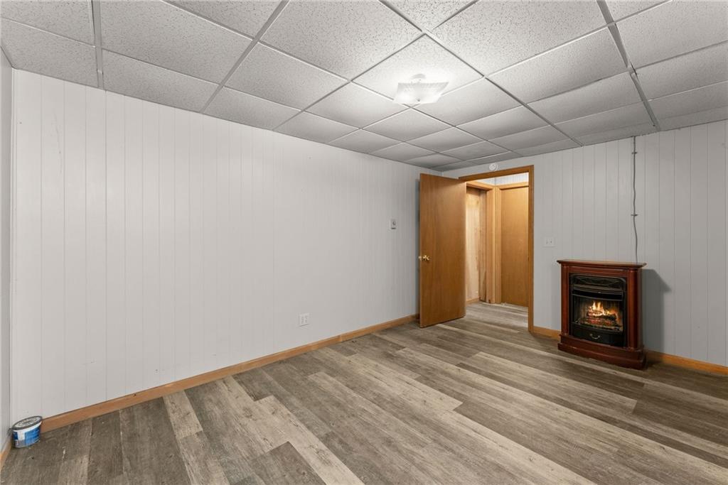279 Cindy Cove Road Blairsville, GA 30512 - Photo 19 of 46 a view of empty room with wooden floor and fireplace