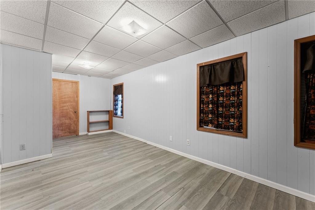 279 Cindy Cove Road Blairsville, GA 30512 - Photo 23 of 46 a view of an empty room with wooden floor and a window