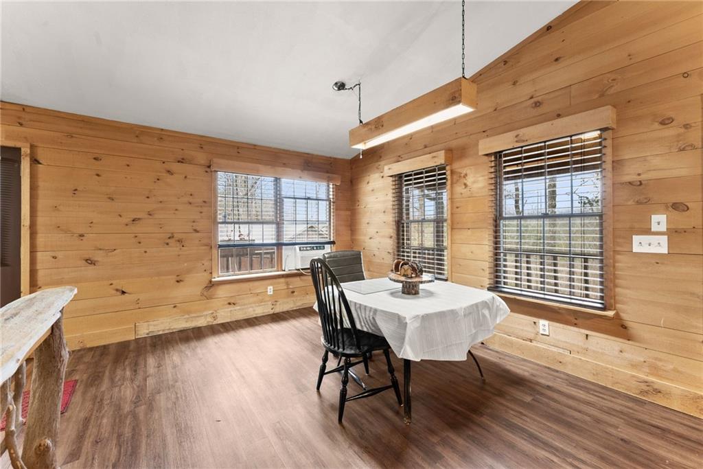 279 Cindy Cove Road Blairsville, GA 30512 - Photo 10 of 46 a dining room with wooden floor and large window
