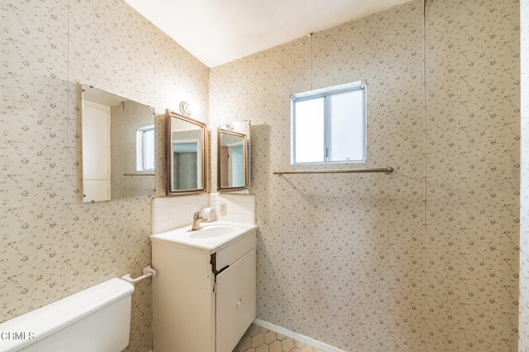 503 West Le Roy Avenue Arcadia, CA 91007 - Photo 26 of 33 a bathroom with a sink and a mirror