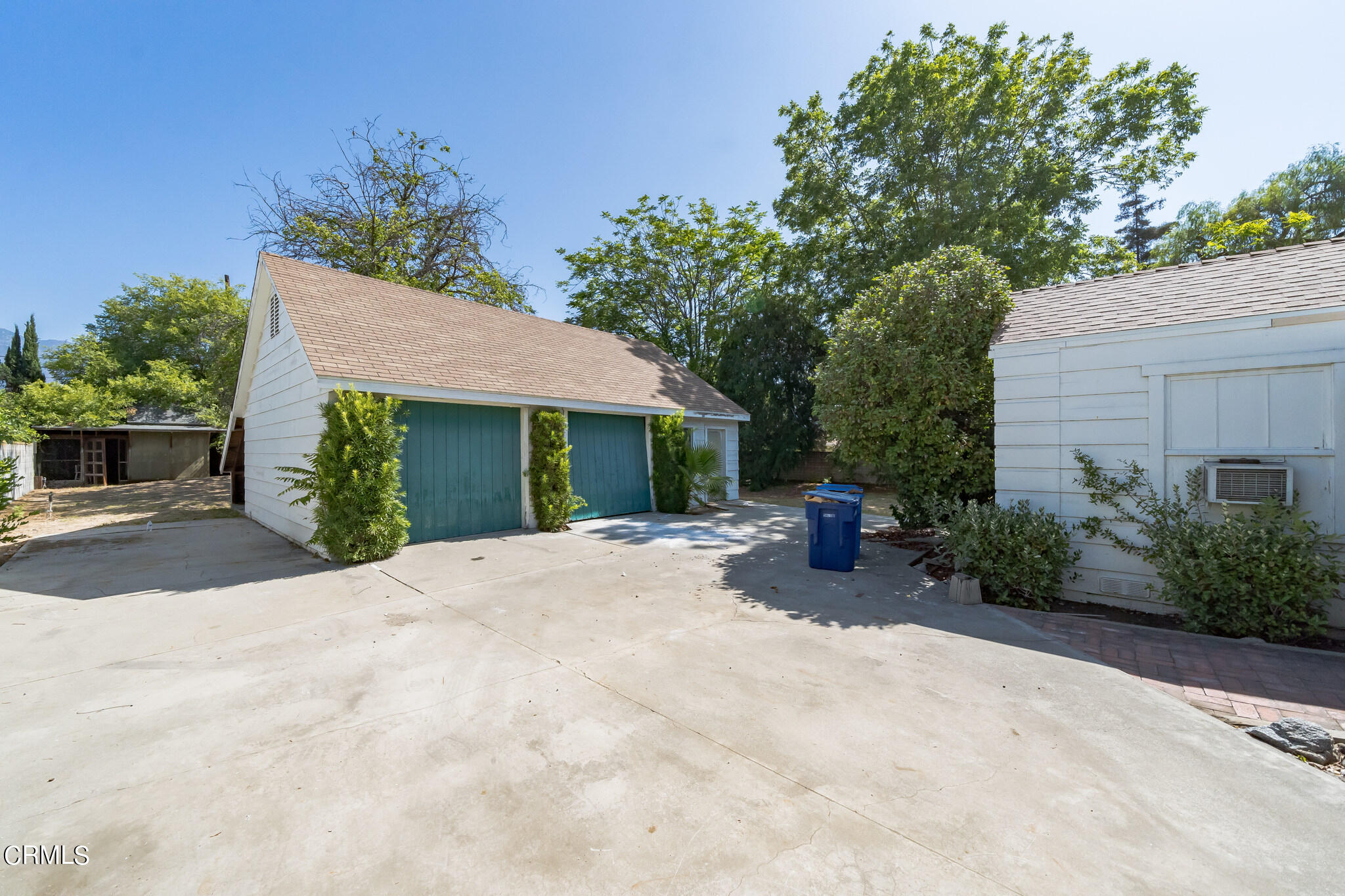 503 West Le Roy Avenue Arcadia, CA 91007 - Photo 29 of 33 a view of a patio with table and chairs potted plants and a large tree