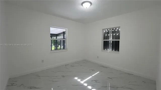 an empty room with windows