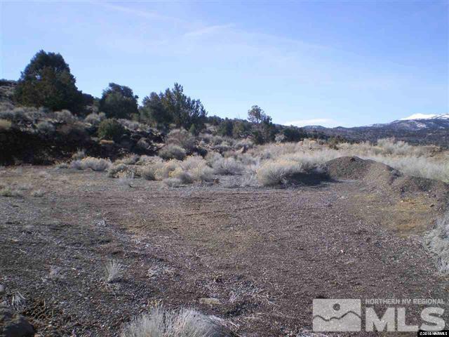 3100 Sheridan Road, Unit 310 Reno, NV 89521 - Photo 7 of 14 a view of a dry yard with wooden fence and mountain view