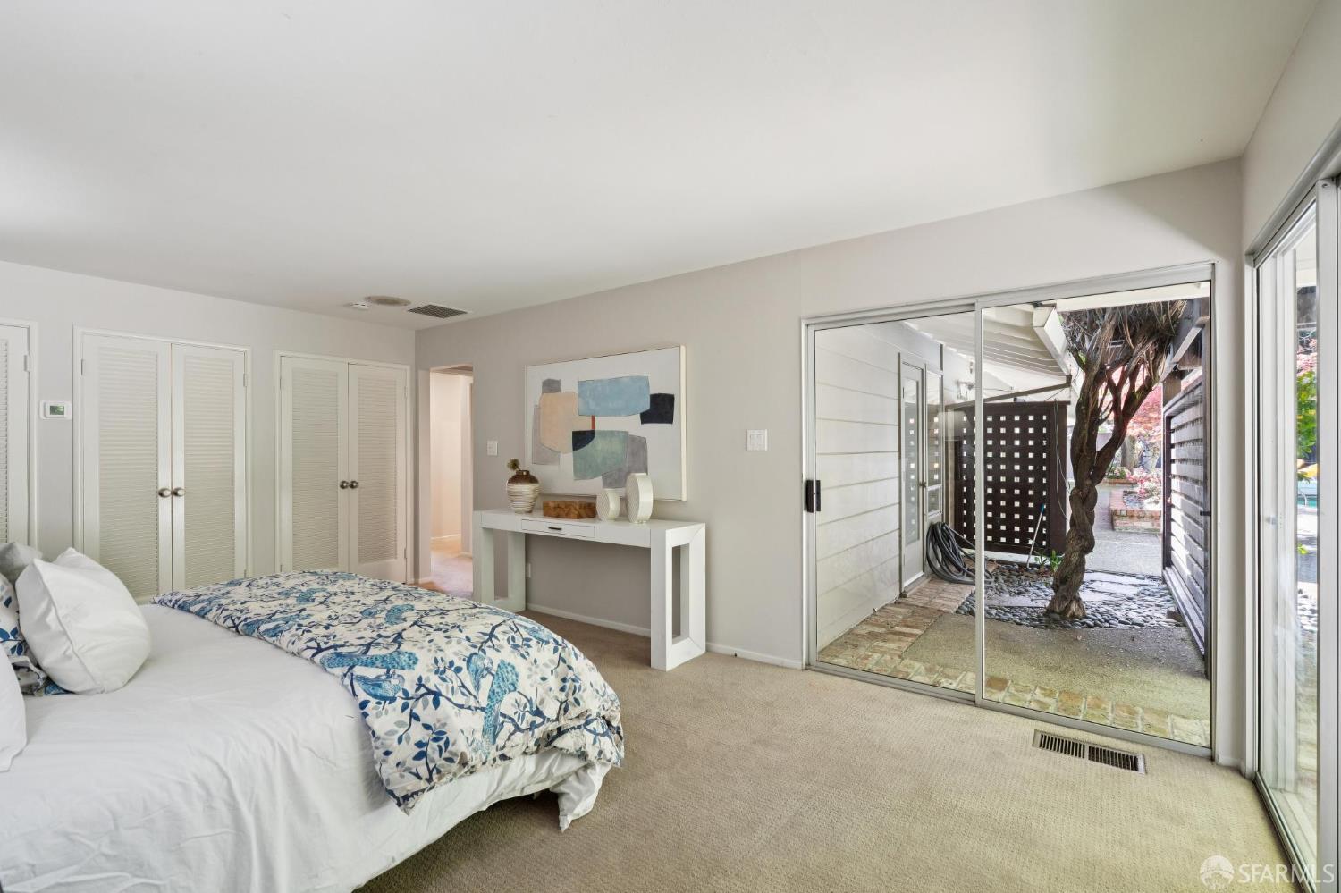 1348 Reliez Valley Road Lafayette, CA 94549 - Photo 25 of 61 a bedroom with a bed and a chair