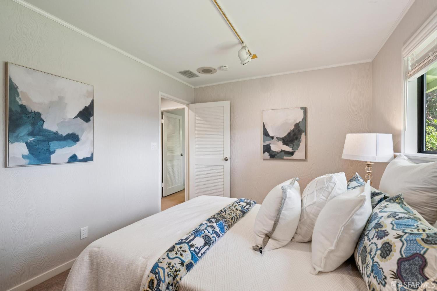 1348 Reliez Valley Road Lafayette, CA 94549 - Photo 33 of 61 a bedroom with a bed and a painting on the wall