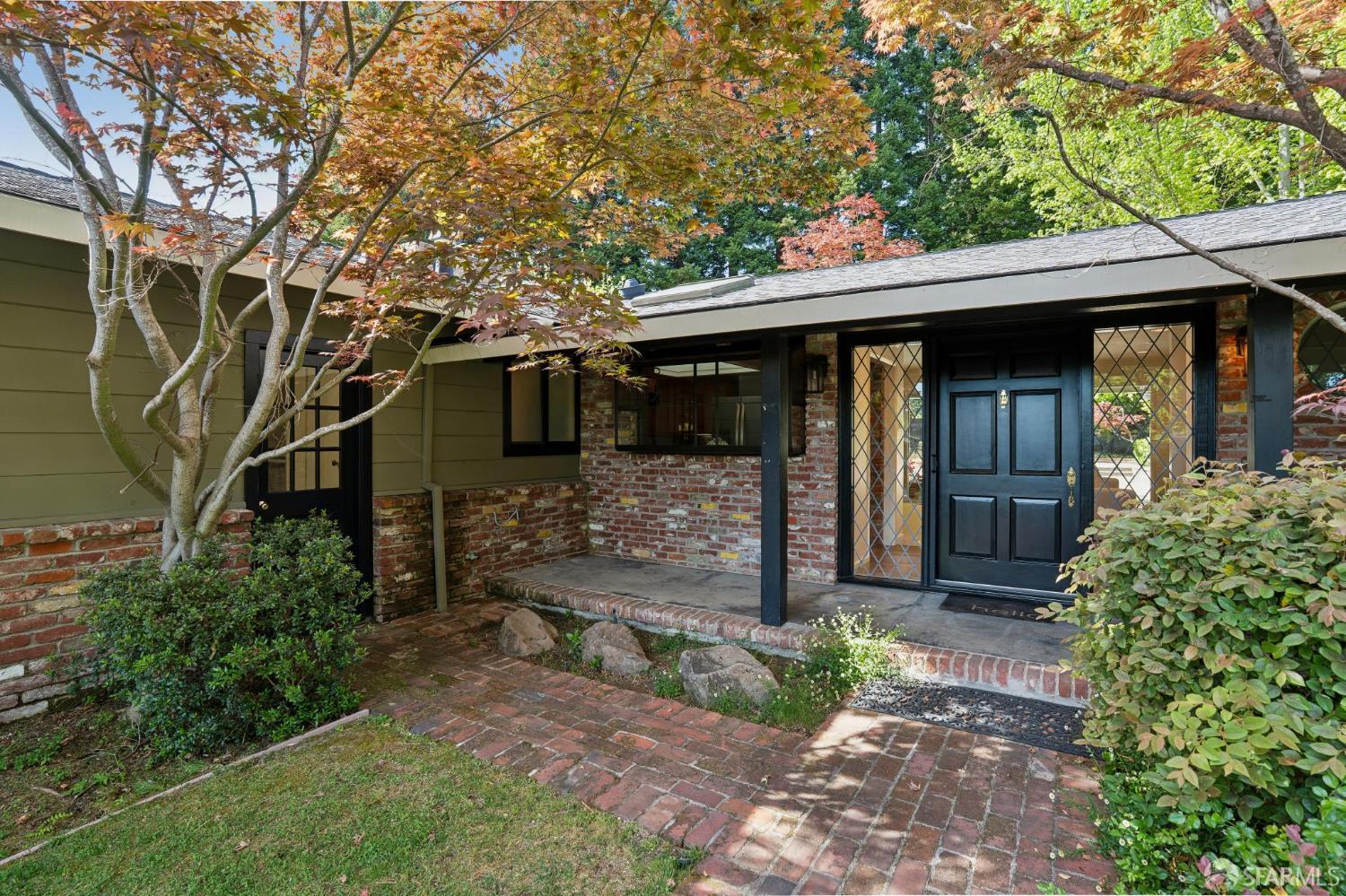 1348 Reliez Valley Road Lafayette, CA 94549 - Photo 4 of 61 a view of a house with a large window and potted plants