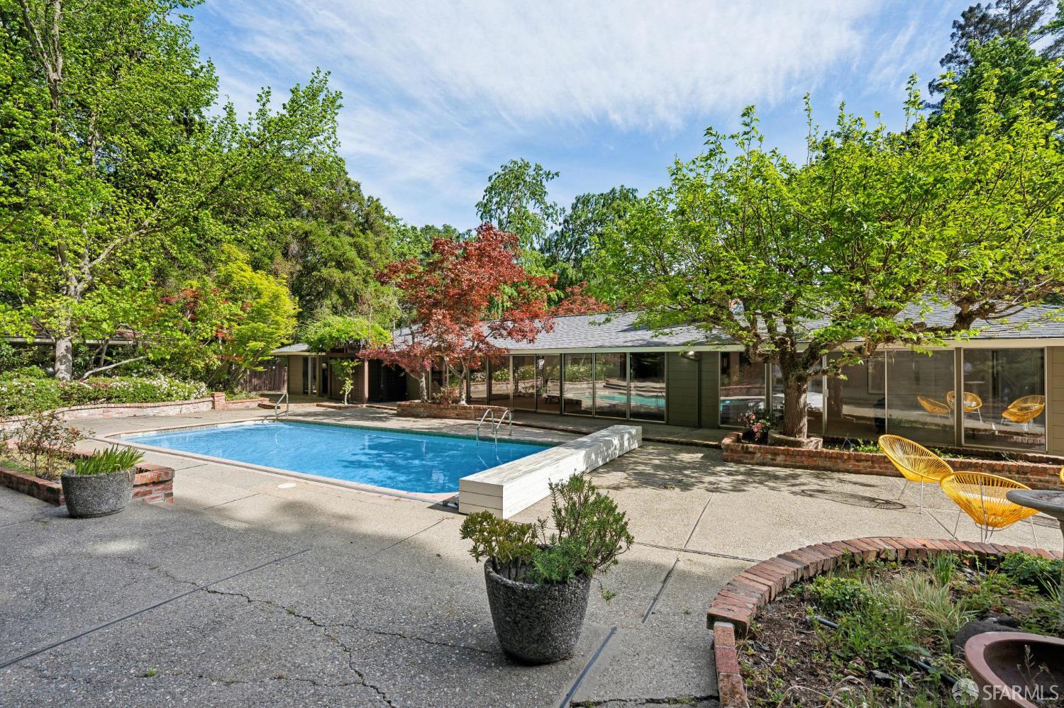 1348 Reliez Valley Road Lafayette, CA 94549 - Photo 47 of 61 a view of a patio with table and chairs potted plants and large tree