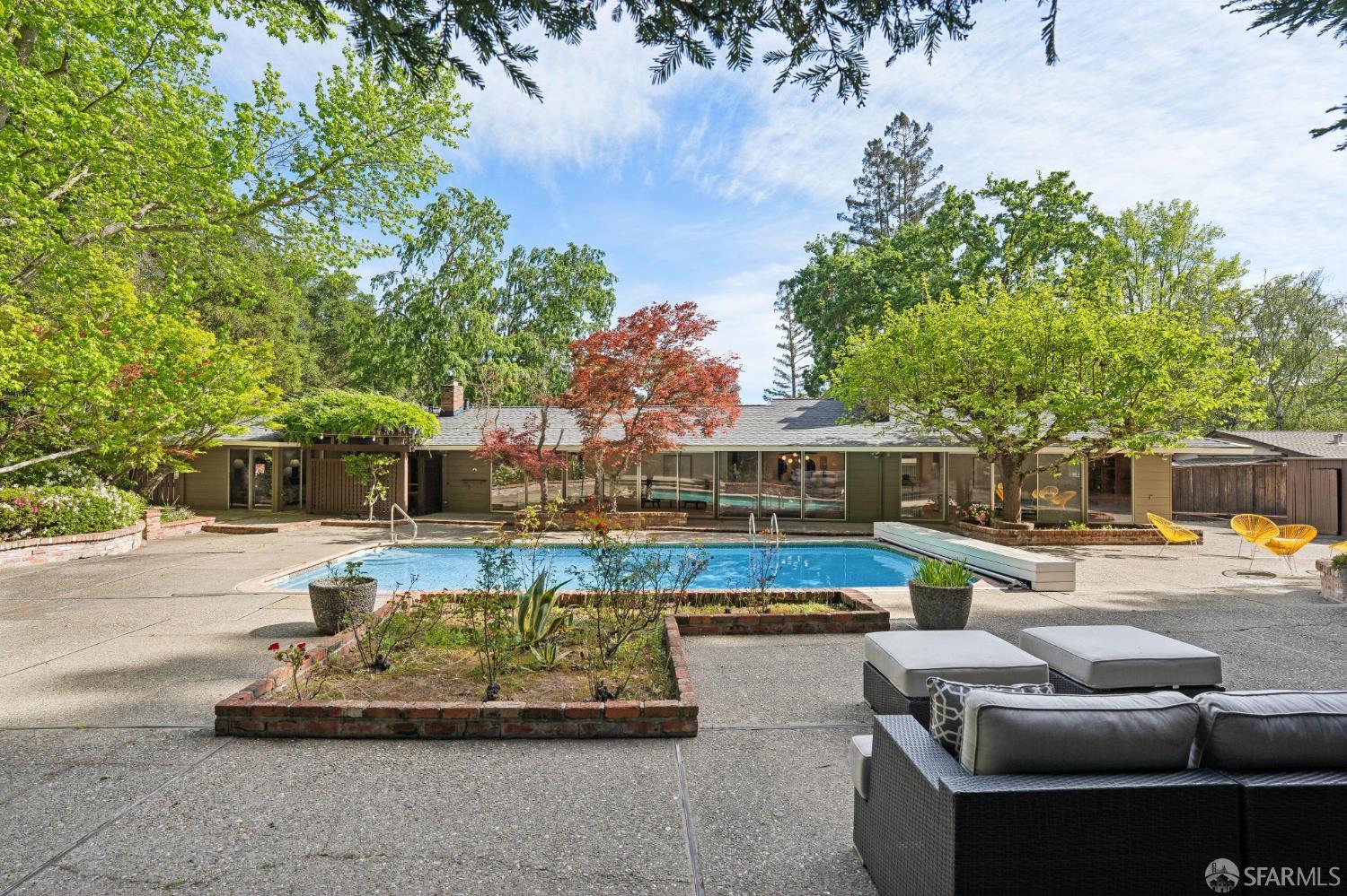 1348 Reliez Valley Road Lafayette, CA 94549 - Photo 49 of 61 a view of a patio with couches and a table and chairs with wooden fence
