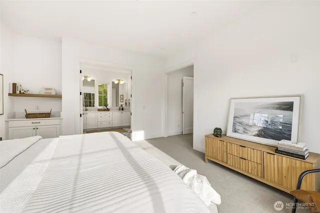a bathroom with a double vanity sink and mirror