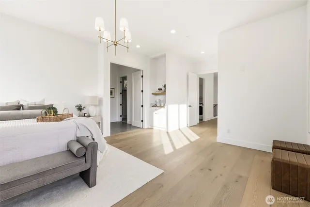 a bathroom with a tub sink shower and mirror