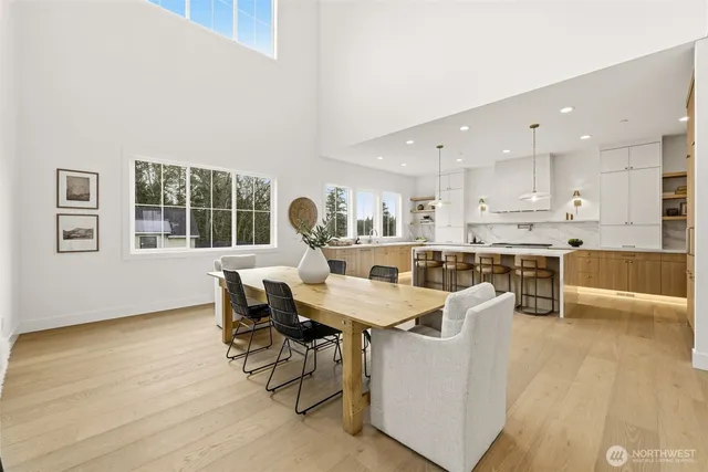 a large kitchen with a table and chairs in it
