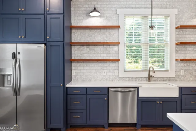 a kitchen with granite countertop a sink and a window