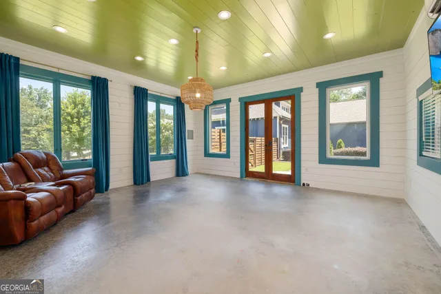 a view of a livingroom with furniture and windows