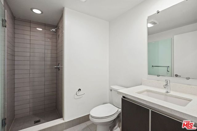 a bathroom with a toilet and shower