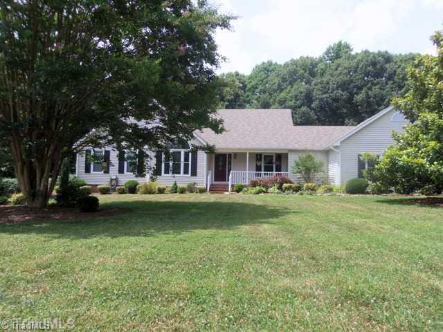 7704 Knollcrest Drive Oak Ridge, NC 27310 - Photo 2 of 16 Exterior Front.