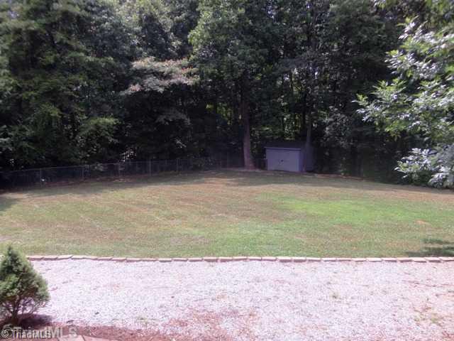 7704 Knollcrest Drive Oak Ridge, NC 27310 - Photo 3 of 16 Exterior Back.