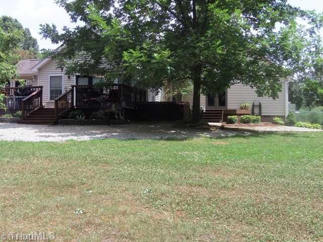 7704 Knollcrest Drive Oak Ridge, NC 27310 - Photo 5 of 16 Exterior Back. Back view of home