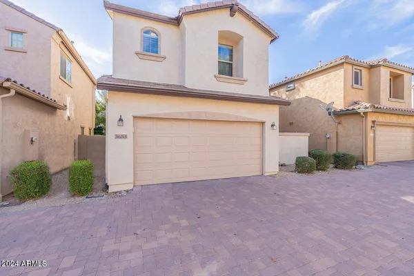 front view of a house with a street